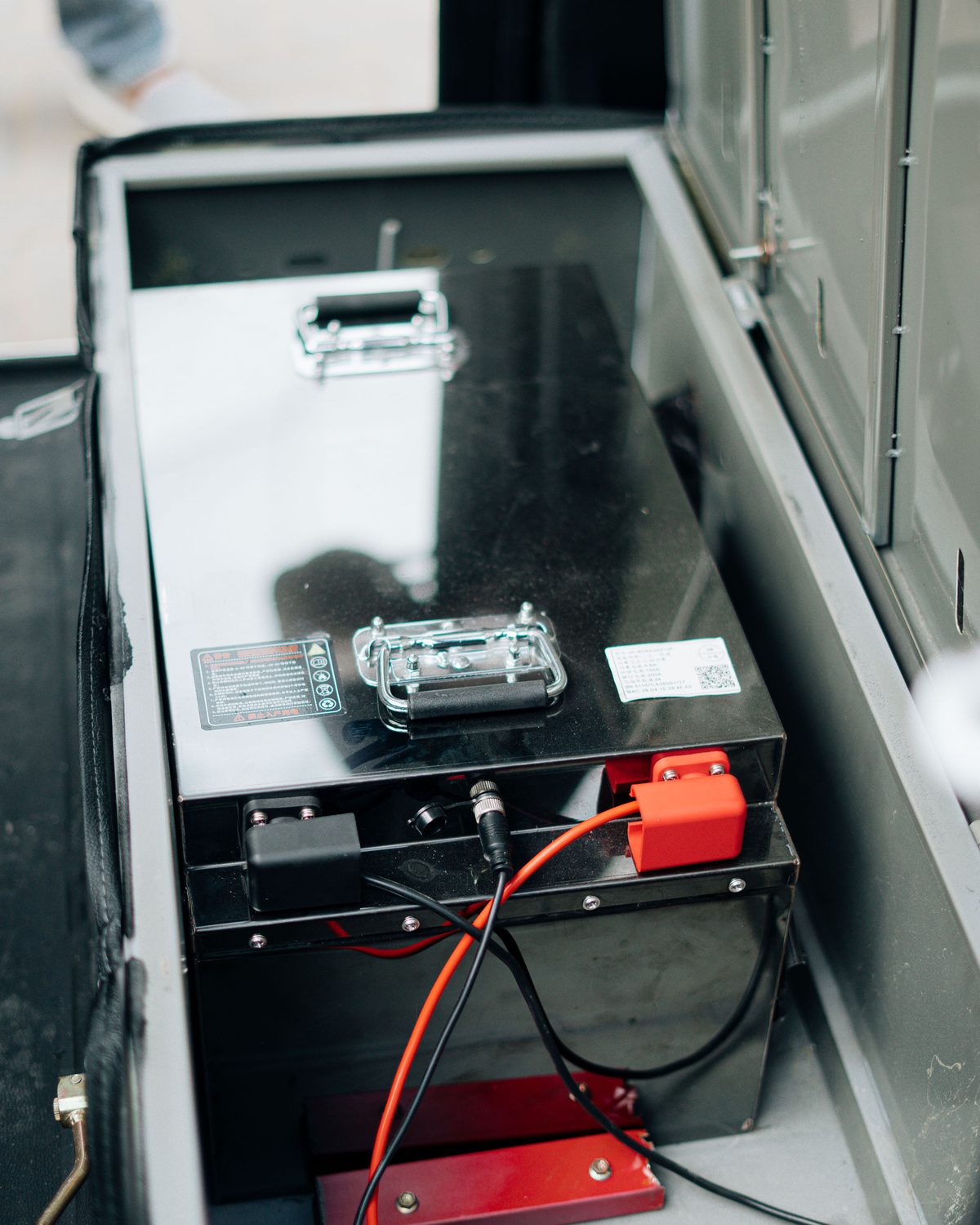 Close-up of an electric vehicle battery pack and connections.