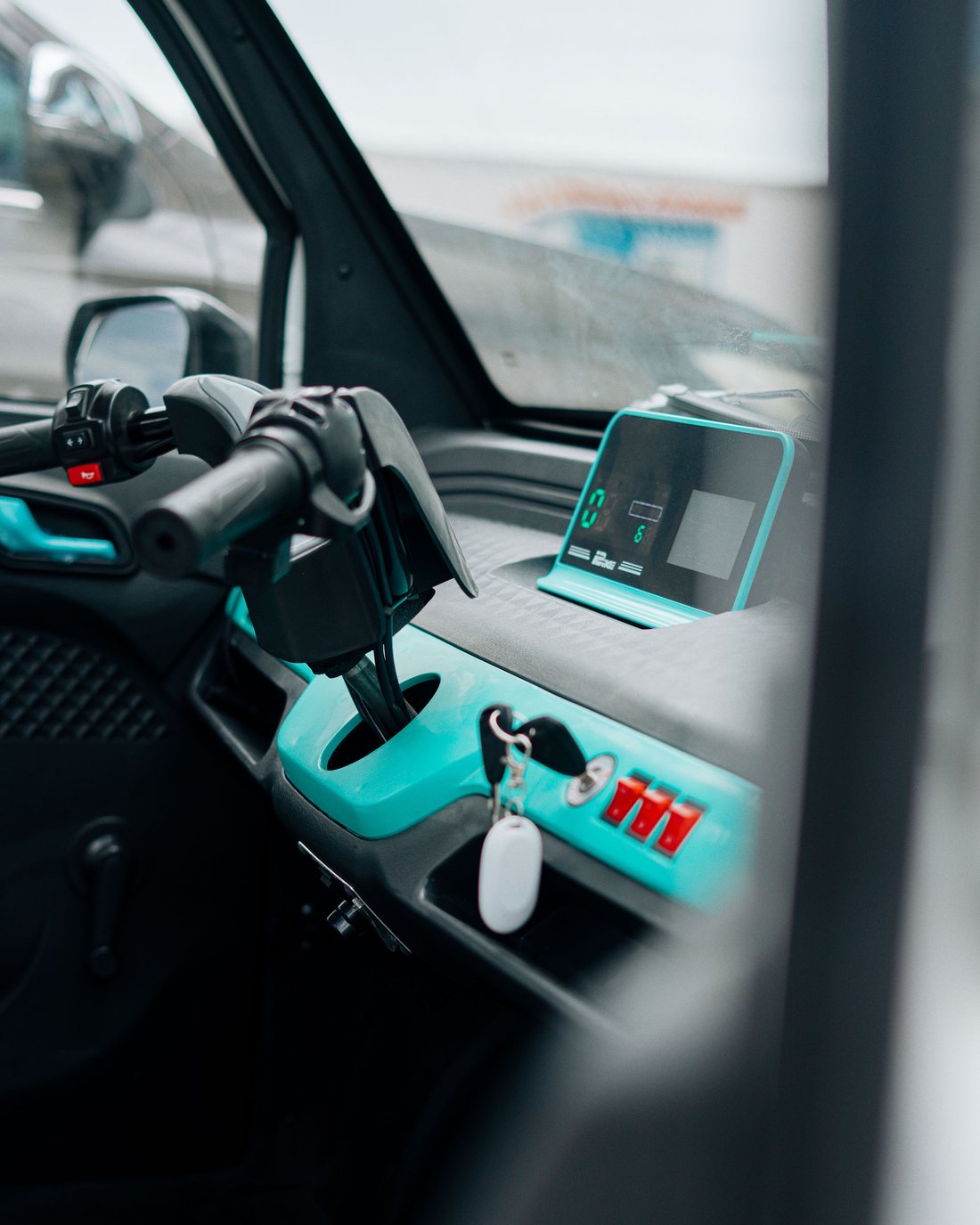 Driver's-eye view of the cabin interior and dashboard of a Mobility Ventures vehicle.