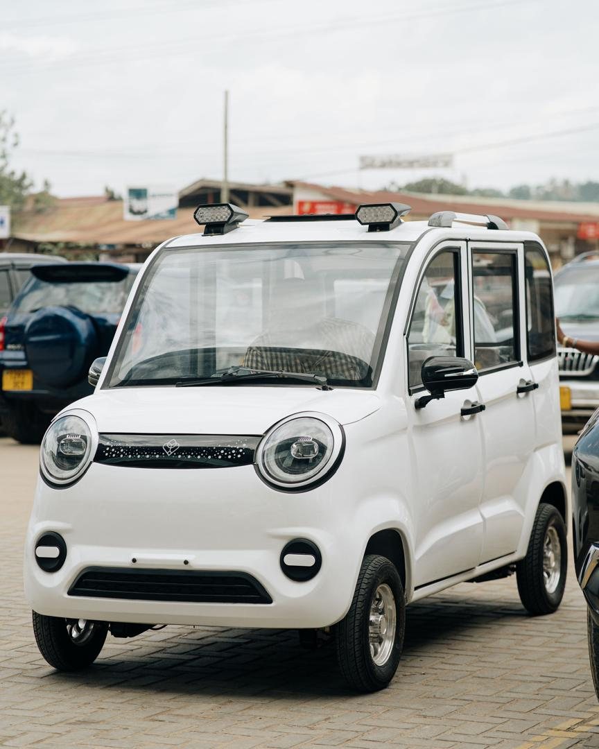 Mobility Ventures vehicle parked on a street in Dar es Salaam with shops in the background.